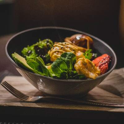 A bowel of Thai food with leafs